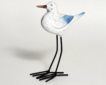 Holz-Vogel auf Metallfüßen